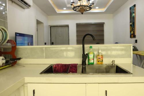 a kitchen counter with a sink in a kitchen at BOL LODGE AND APaRTMENT 3 in Oturkpo