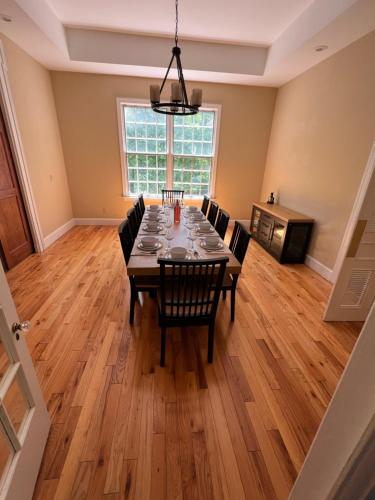 a dining room with a table and chairs at Beautiful River front home with private pool in Phillipsburg