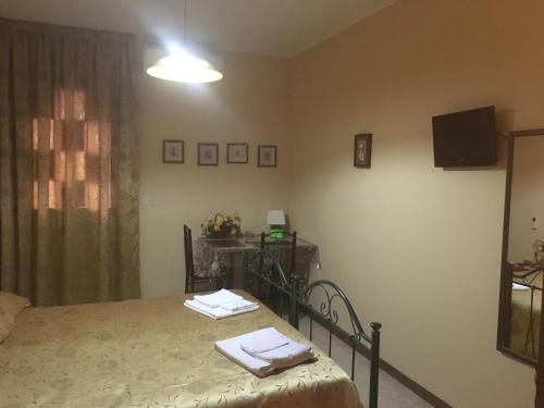 Et tv og/eller underholdning på Monolocale e Bilocale Villa Adelaide