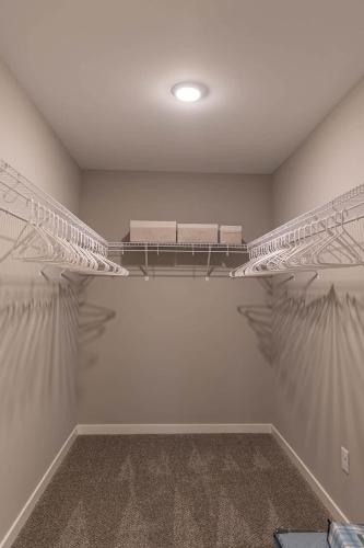 a room with two shelves on the wall at Brand New 2 Bed with Office in Loves Park