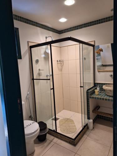 a bathroom with a shower and a toilet at Urikana Boutique Hotel in Teresópolis