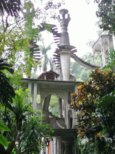a building with a fountain on top of it at Grann Posada Xilitla in Xilitla