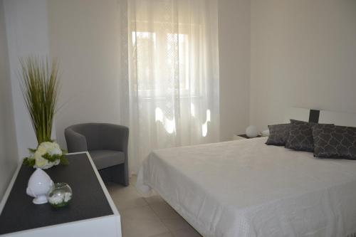 Posteľ alebo postele v izbe v ubytovaní Alba Apartment - Villaggio di Mary