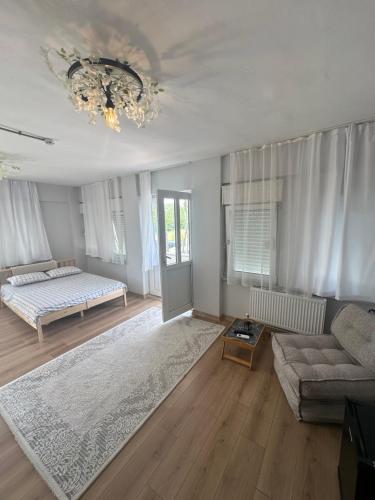 a living room with a bed and a couch at Bike Hub Şile in Sile