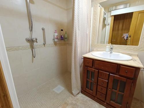 a bathroom with a sink and a shower at Casa Purissima 31 in Benissa