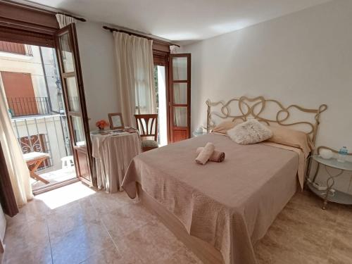 a bedroom with a bed with a stuffed animal on it at Casa Purissima 31 in Benissa