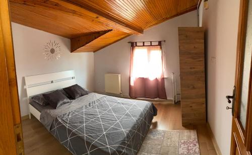 a bedroom with a bed and a window at Bike Hub Şile in Sile