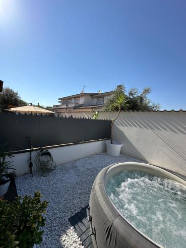 a hot tub sitting on the side of a house at VILLA SEASIDE HAVEN - Private Retreat with Garden in Anzio in Anzio