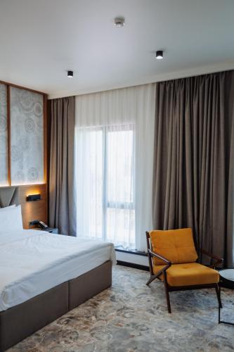 Кровать или кровати в номере Aurum Garden Hotel
