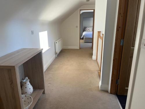 a hallway with a hallway leading to a bedroom at Chestnut Lodge Ballindrum R14YW02 in Athy