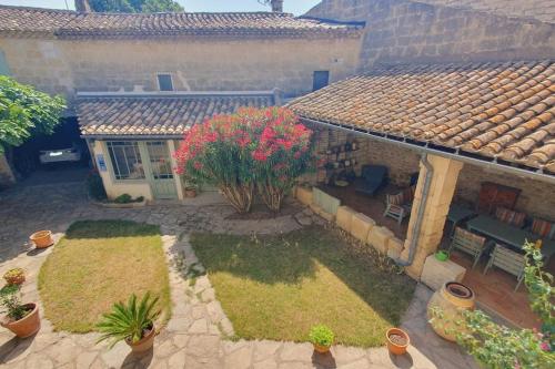 an aerial view of a house with a garden at Maison de Village en Camargue Parking Clim Wifi - ROSSIconciergerie - Linge inclus in Saint-Laurent-dʼAigouze