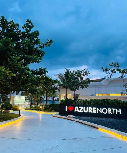 a sign that reads avalon resort in front of a building at New Cozy Studio Unit in Azure North Pampanga with Pool View in Lagundi