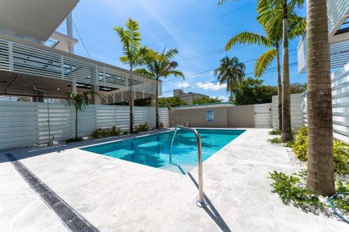a swimming pool in the backyard of a house at Lux 3BR City-View Retreat in Hollywood, 2nd Floor in Hollywood