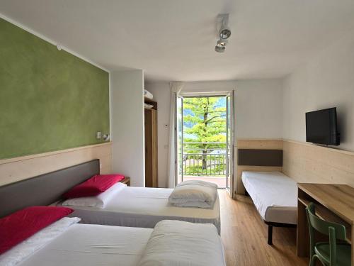 Una cama o camas en una habitación de Hotel Miramonti
