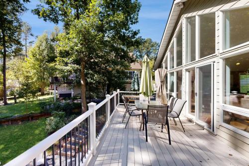 a deck with chairs and a table on a house at Turtle Cove in Glenora