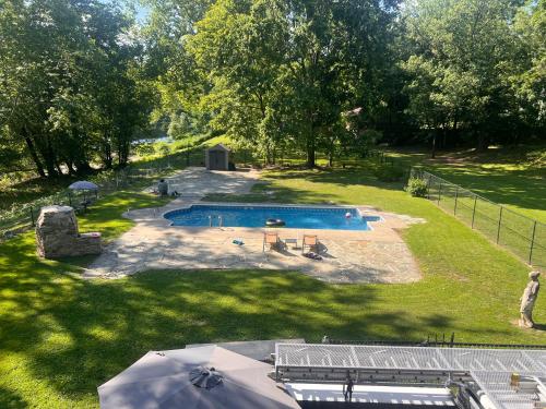 an overhead view of a swimming pool in a yard at Beautiful River front home with private pool in Phillipsburg