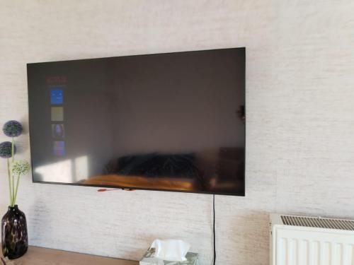 TV a/nebo společenská místnost v ubytování julia