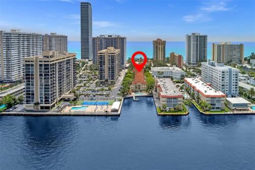 a red spot on top of a city with buildings at Bayside Townhome - Private Beach Access, Pool and Hot Tub, Free Parking in Golden Isles