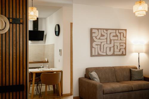 a living room with a couch and a table at Montehome in Becici