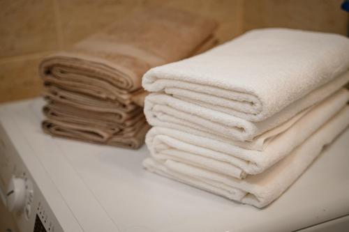 a pile of towels sitting on top of a counter at Montehome in Becici