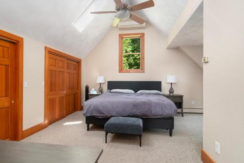 a bedroom with a bed and a ceiling fan at Lakefront-hot Tub Gym Kayaks Paddleboards in Thompson