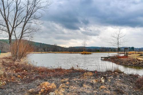 a large body of water with a boat in it at Deck and Views Spacious Lake House Escape in Hodgen