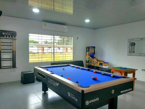 a living room with a pool table in it at HOTEL y RESTAURANTE RANCHO GRANDE in Cicuco