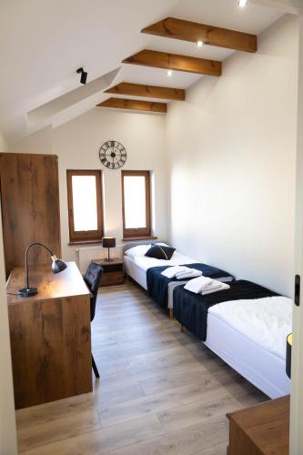 Postel nebo postele na pokoji v ubytování Apartamenty Chrobrego 10
