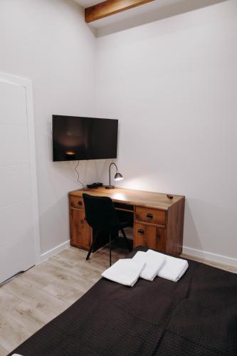 Postel nebo postele na pokoji v ubytování Apartamenty Chrobrego 10