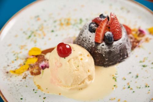 a dessert with fruit on a white plate at Libre Hotel, BW Signature Collection by Best Western in Lima