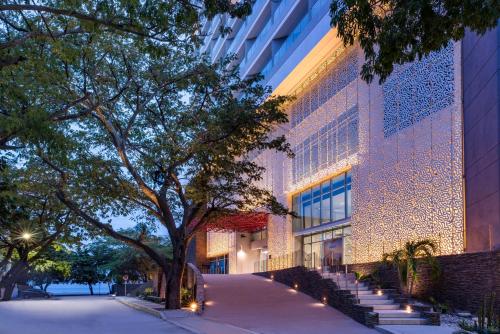 a building with lights on the side of it at Hilton Santa Marta in Santa Marta