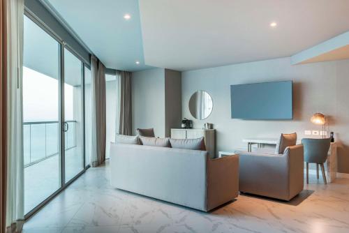 a living room with a couch and a table at Hilton Santa Marta in Santa Marta