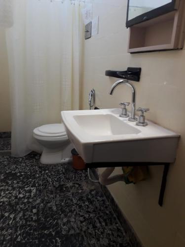 a bathroom with a sink and a toilet at Chalet Paloma 3 in La Falda