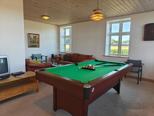 a living room with a pool table in a room at 20 person holiday home in Nordborg-By Traum in Nordborg