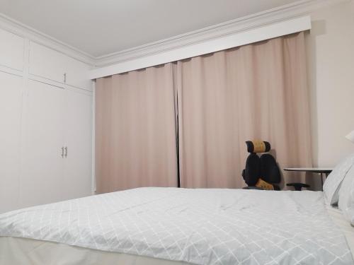 Ένα ή περισσότερα κρεβάτια σε δωμάτιο στο 墨尔本Balwyn north独立卫浴全屋地毯舒适大房