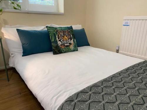 a bed with two pillows on top of it at Wilson House - Camden in London