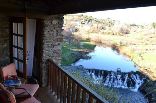 a view of a river from a balcony at Casa de Onor in Rio de Onor