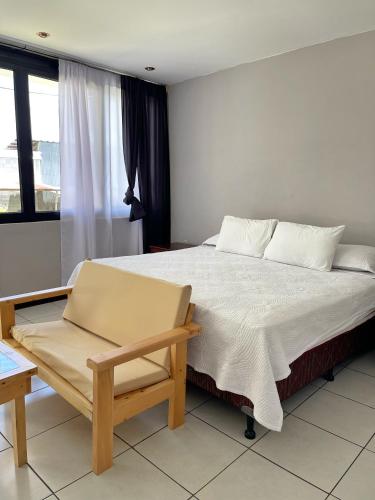Postel nebo postele na pokoji v ubytování Habitacion privada Lamat I