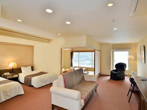 Postel nebo postele na pokoji v ubytování Bay Resort Hotel Shodoshima
