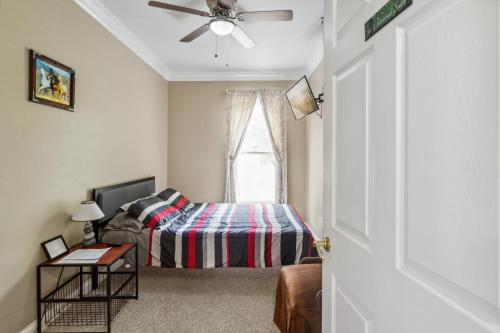 a bedroom with a bed and a window at Country Cove in Brentwood