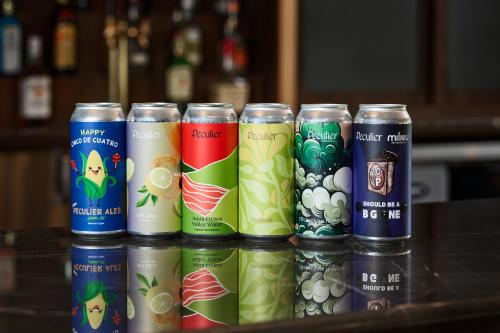 a row of energy drink cans sitting on a table at Courtyard by Marriott Fort Collins in Fort Collins