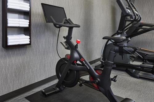 a room with a bike and a computer monitor at Courtyard by Marriott Fort Collins in Fort Collins