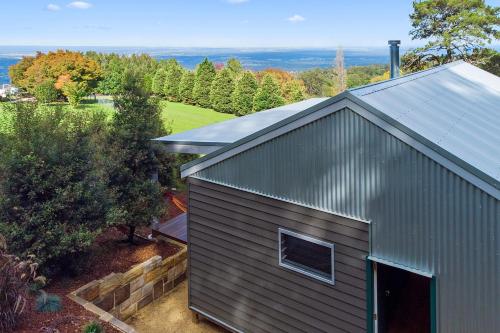 an overhead view of a house with a roof at Skyfarm in Kurrajong