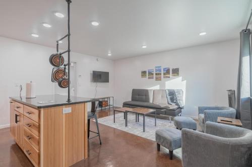 a living room with a table and chairs and a couch at The Executive Southernwind Suite 2.0 in Fairbanks
