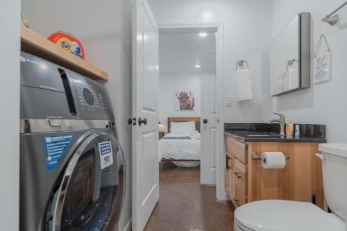 a small bathroom with a washing machine in it at The Executive Southernwind Suite 2.0 in Fairbanks