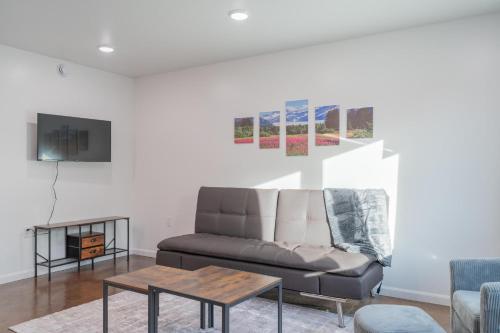 a living room with a couch and a table at The Pet Friendly Executive Northernwind Suite 1.0 in Fairbanks