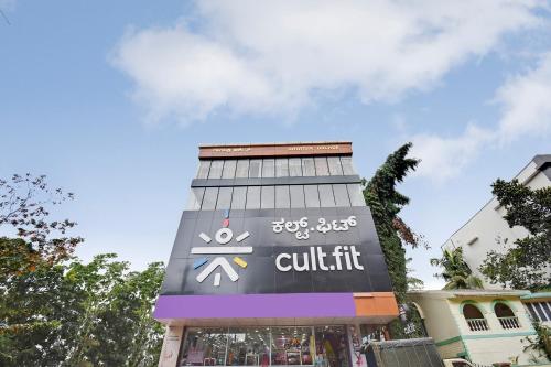a building with a sign on the side of it at SPOT ON Gayatri Comforts in Bengaluru