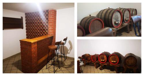 a bunch of wine barrels in a room at Kuća za odmor "Villa Merkur" - Orahovica in Orahovica