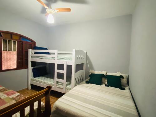 Postel nebo postele na pokoji v ubytování Fregatti´s Beach Mongaguá