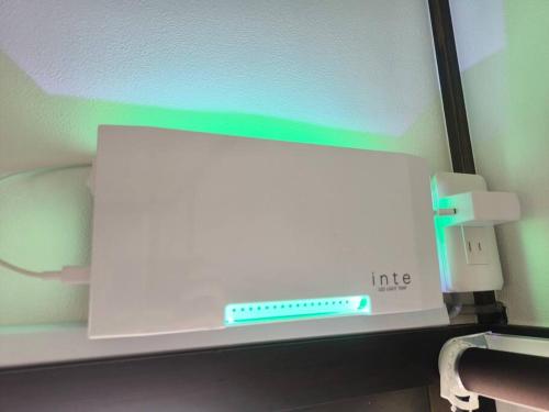 a white computer monitor sitting on a desk at INN Kumihama 丹後 一棟貸し 海の宿 INN久美浜 in Kyotango